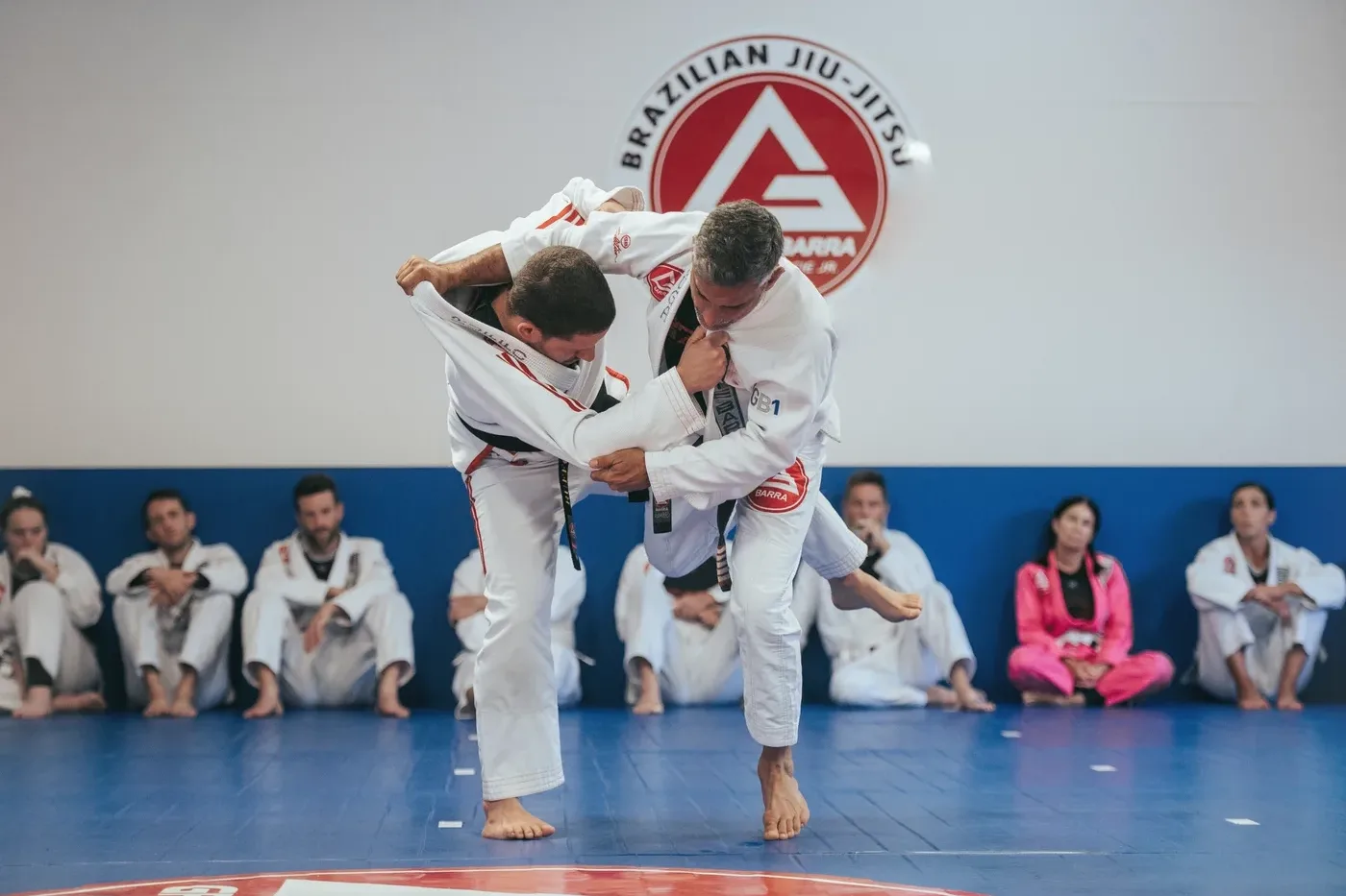 Gracie Barra students training Brazilian Jiu-Jitsu on the mats