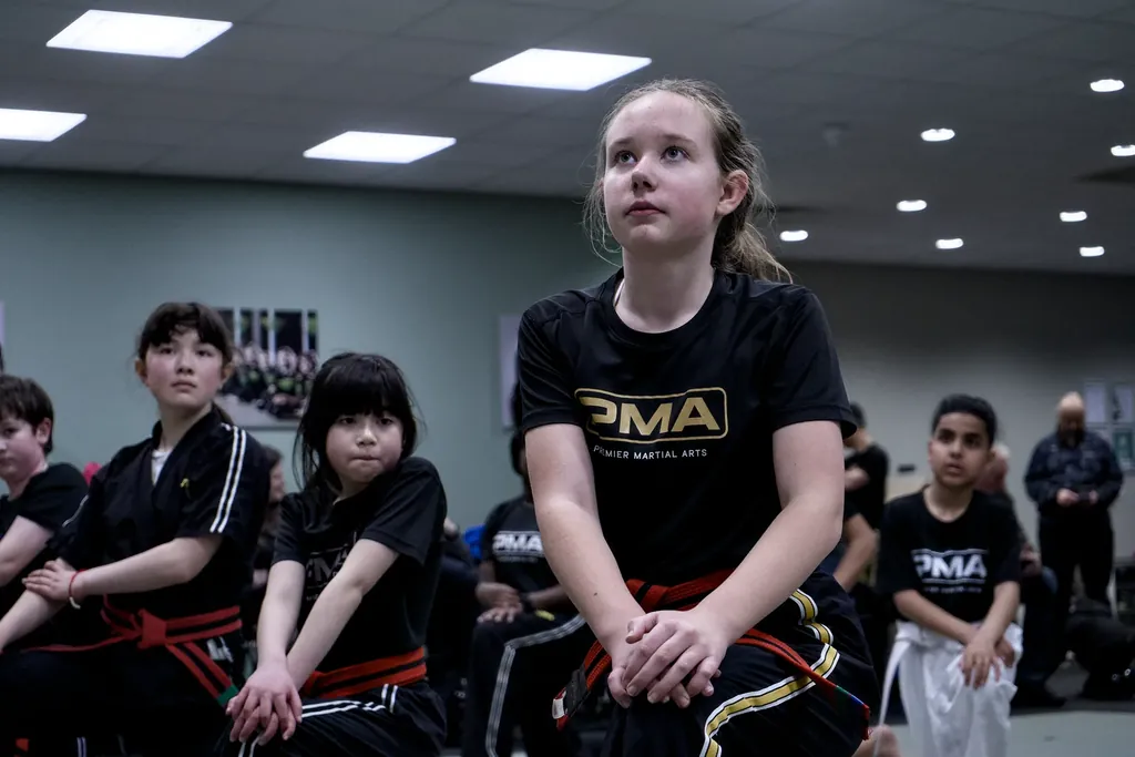 Students lined up on the mats at the start of class